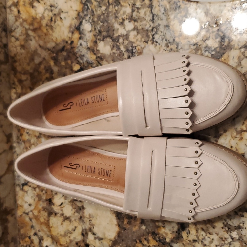 Classic Leila Stone, leather fringed penny loafers in cream.